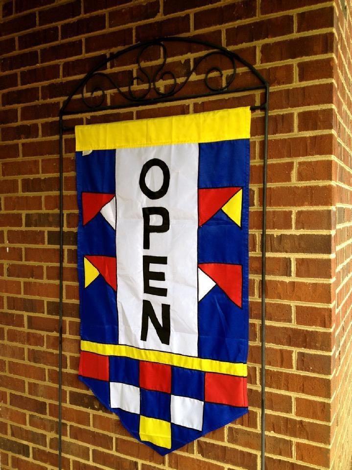 open flag and large wrought iron flag stand from bald eagle industries and bald eagle flag store, Double Sided Open Flag is fully sewn appliquéd and embroidered, Bald Eagle Flag Store is a woman owned business
