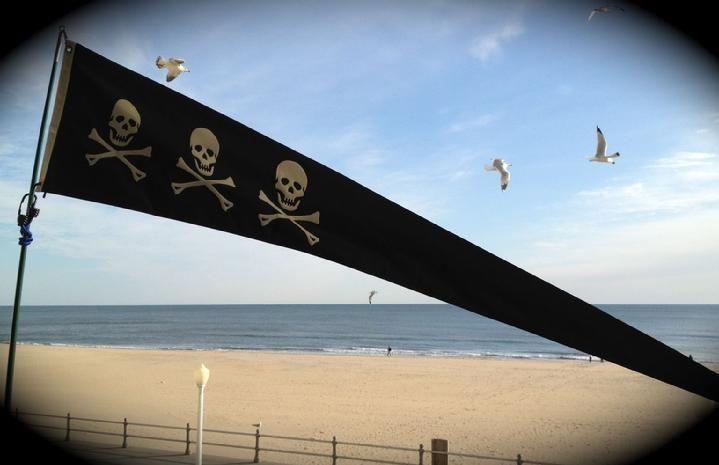 skull and crossbones pirate pennant pirate flag from bald eagle flag store fredericksburg va, skull and crossbones pirate pennant and windsock pole at barclay towers hotel va beach by bald eagle flag store